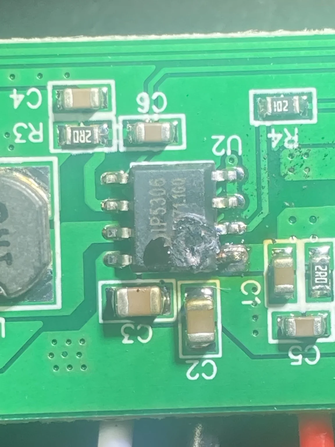 Close view of a damaged surface-mount integrated circuit