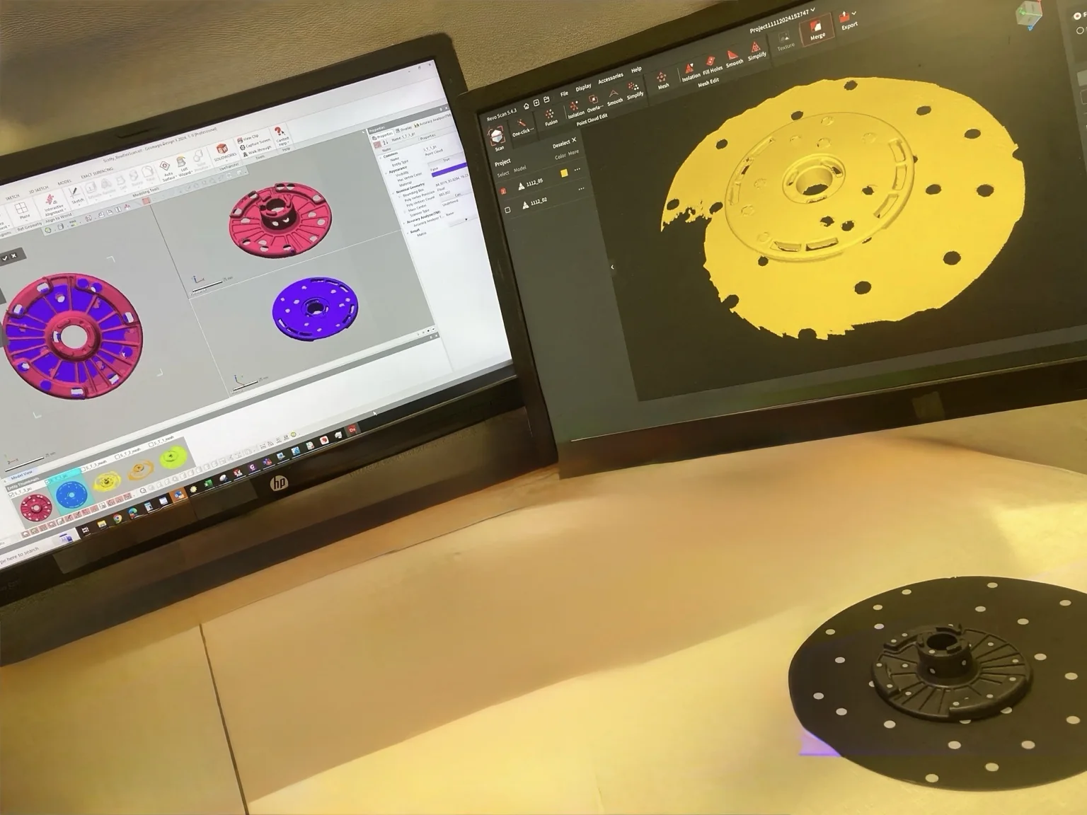Reverse engineering workstation showing scan data and CAD reconstruction