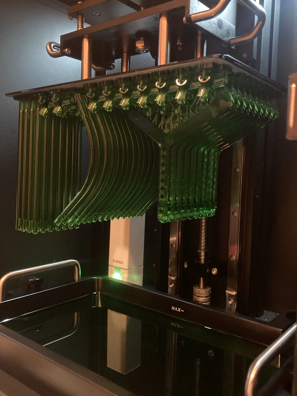 SLA resin printer producing a batch of precision parts